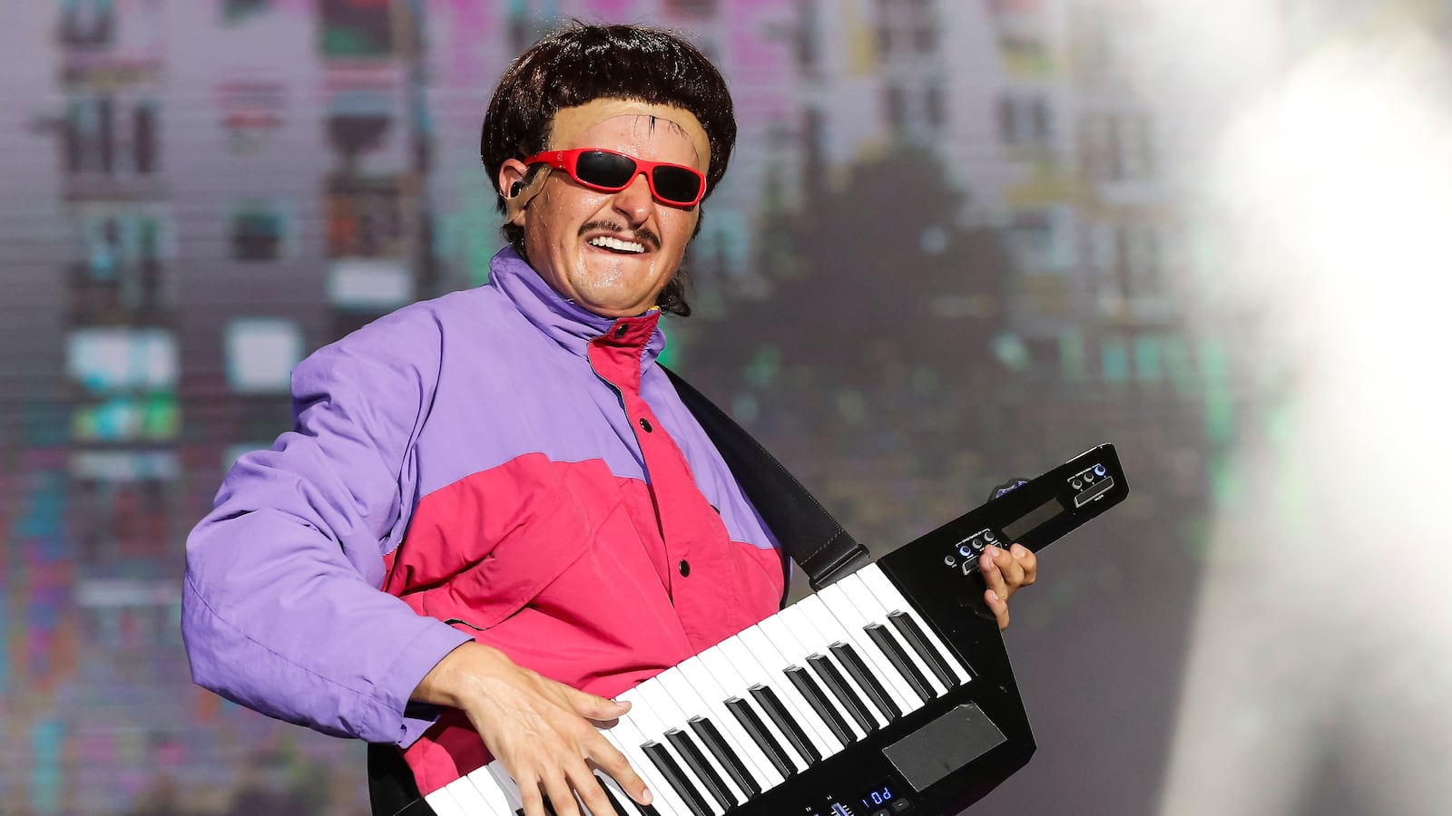 Oliver Tree performing on stage.
