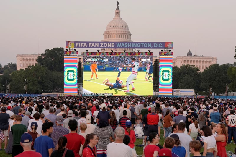 Soccer Football - FIFA World Cup 2026 - Round of 32 - United States v Bosnia and Herzegovina- Fans gather in Washington - Washington, D.C., U.S. - July 1, 2026 United States fans watch the match on a big screen at the National Mall as The United States Capitol building is seen in the background REUTERS/Cheney Orr     TPX IMAGES OF THE DAY