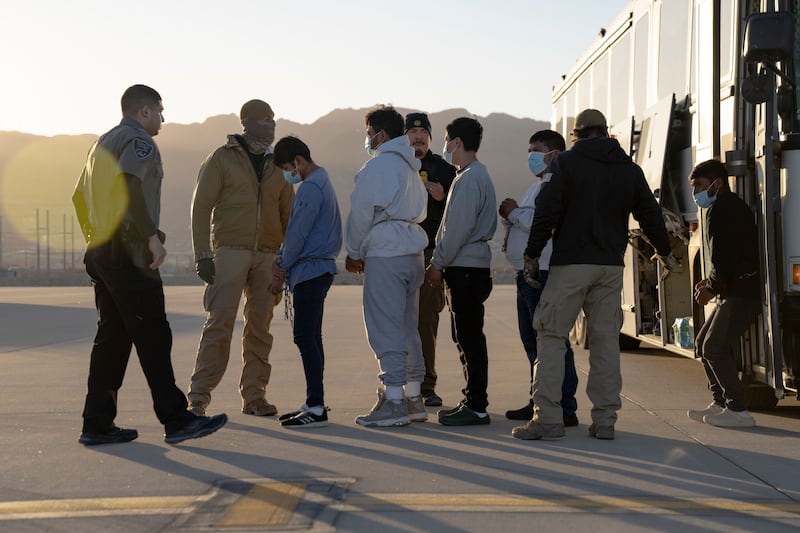 FORT BLISS, TX - JANUARY 23, 2025:  (EDITOR'S NOTE: This Handout image was provided by a third-party organization and may not adhere to Getty Images' editorial policy.) In this handout provided by the U.S. Department of Defense, U.S. Customs and Border Protection security agents guide illegal immigrants to board a removal flight on January 23, 2025 at Fort Bliss, Texas. Under the direction of U.S. Northern Command, the U.S. Transportation Command is supporting Immigration and Customs Enforcement removal flights by providing military airlift. (Photo by U.S. Army Sgt. 1st Class Nicholas J. De La Pena/U.S. Department of Defense via Getty Images)
