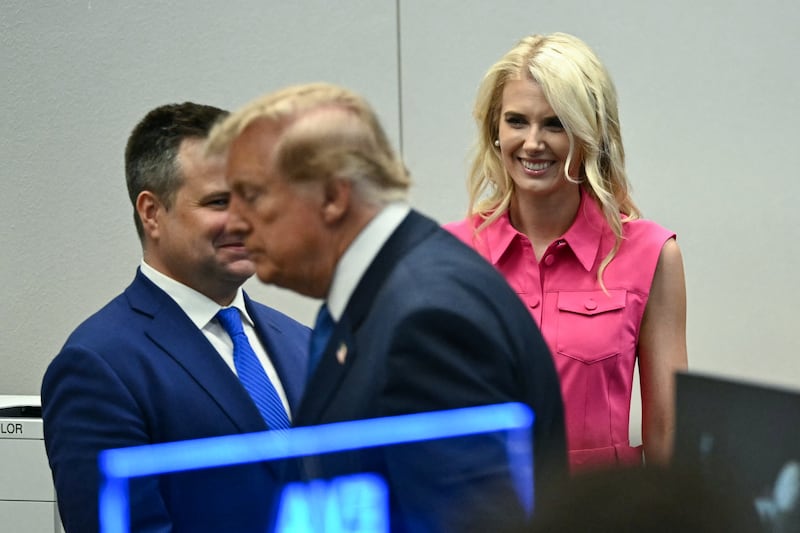 Natalie Harp, aide to US President Donald Trump, looks on as President Trump visits the Mission Control Center at NASA Lyndon B. Johnson Space Center in Houston, Texas, on August 28, 2026.