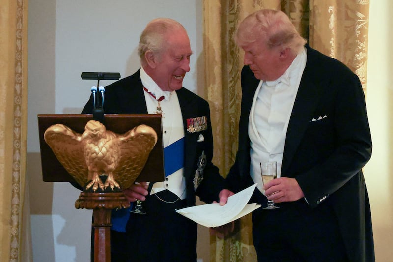Britain's King Charles and U.S. President Donald Trump interact during a state dinner for the King and Queen Camilla at the White House in Washington, D.C., U.S., April 28, 2026. REUTERS/Suzanne Plunkett