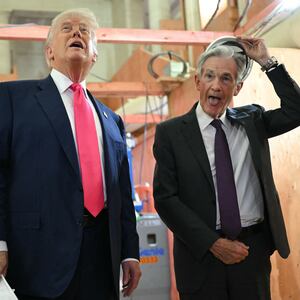 US President Donald Trump speaks with Federal Reserve chair Jerome Powell (R) as he visits the Federal Reserve in Washington, DC, on July 24, 2025.