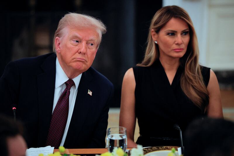 U.S. President Donald Trump and first lady Melania Trump attend a private dinner for technology and business leaders in the State Dining Room at the White House in Washington, D.C., U.S., September 4, 2025.  REUTERS/Brian Snyder