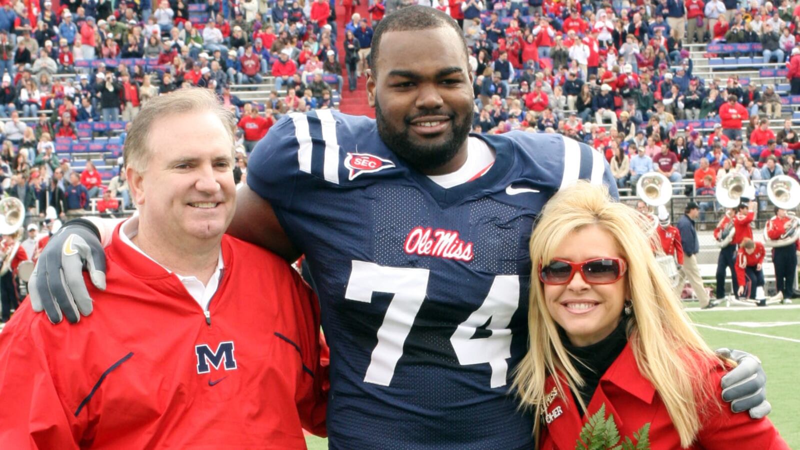 Michael Oher alongside Sean and Leigh Anne Tuohy