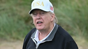 President Donald Trump reacts after playing from the first tee to officially open the Trump International Golf Links course in Balmedie, Aberdeenshire, north east Scotland on July 29, 2025.