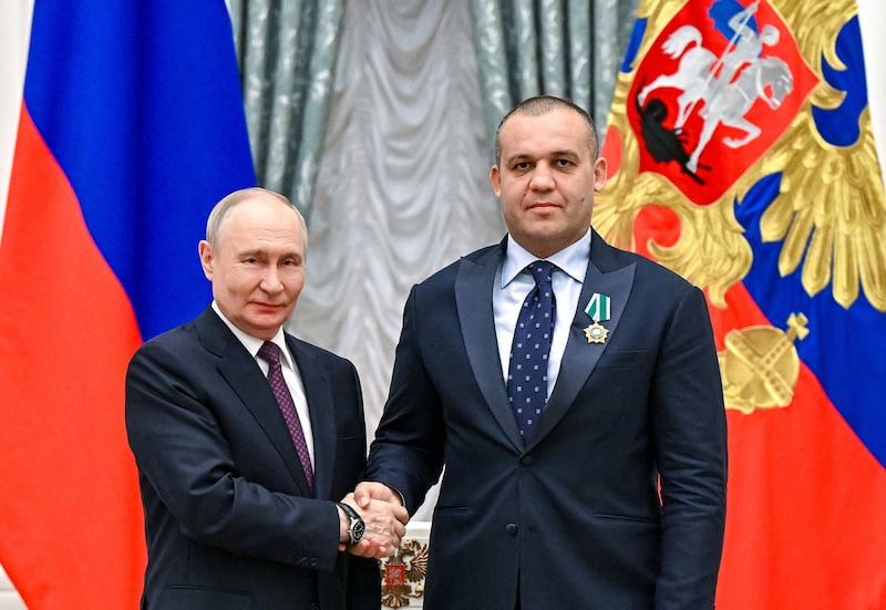 Russian President Vladimir Putin awards chairman of the executive committee of the Russian Boxing Federation Umar Kremlev with the Order of Friendship during a ceremony to present state decorations to world boxing champions at the Kremlin in Moscow, Russia April 22, 2026.