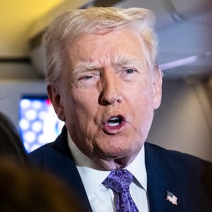 IN FLIGHT - NOVEMBER 30: President Donald Trump speaks to the press aboard Air Force One en-route to Washington, DC on November 30, 2025. The first family is returning to Washington, DC after spending the Thanksgiving holiday at Mar-A-Lago Resort In Florida.  (Photo by Pete Marovich/Getty Images)