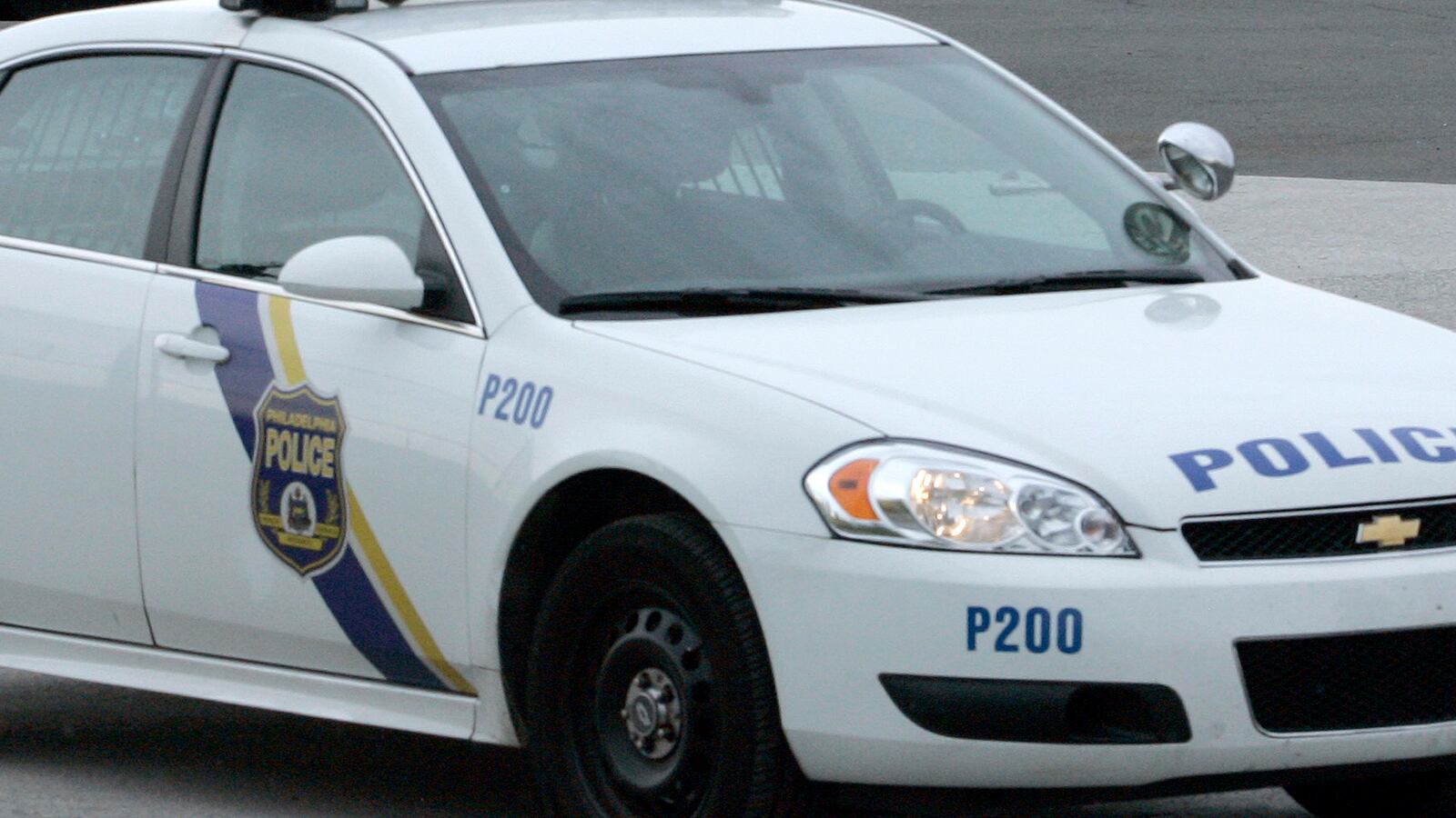 FBI and Philadelphia Police vehicles are seen parked near Gate 11 where a US Airways plane was searched after being ordered back to Philadelphia International Airport following a report of explosives onboard