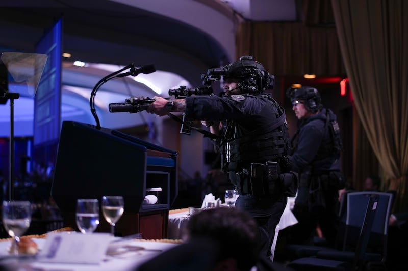 Agents stand guard after an incident at the annual White House Correspondents Association Dinner April 25, 2026 in Washington, DC.