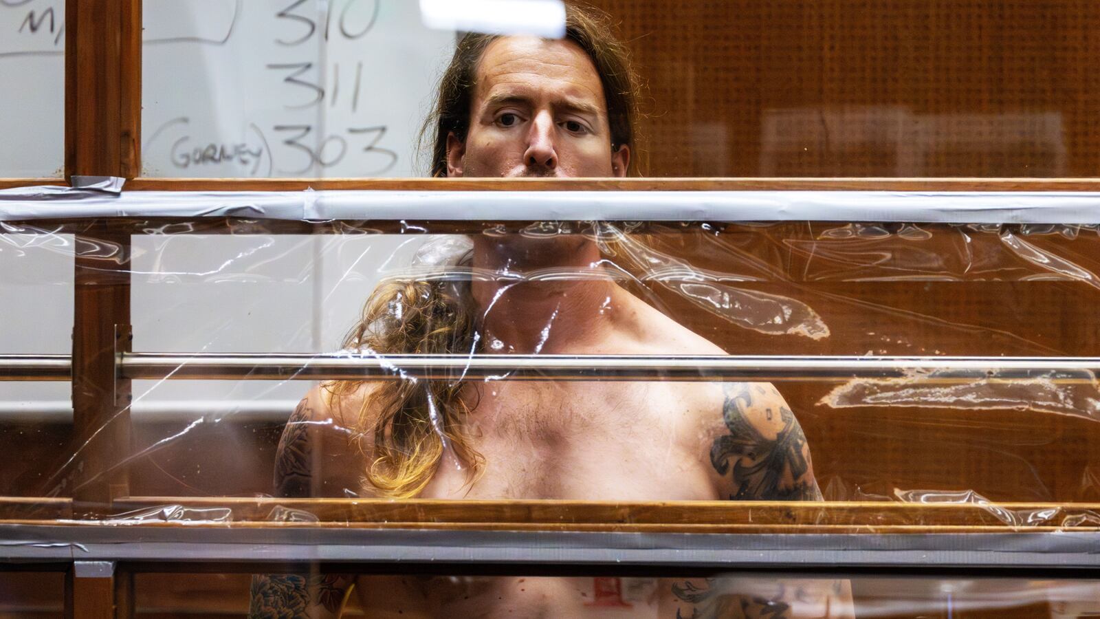 Sam Haskell shirtless in suicide prevention gear appears in court