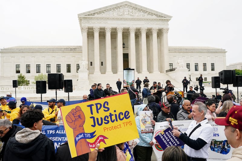 Immigrants' rights activists and demonstrators attend a rally outside the U.S. Supreme Court, as justices were scheduled to hear arguments on whether the administration of U.S. President Donald Trump can end the Temporary Protected Status (TPS) of Syrian and Haitian nationals, in Washington, D.C., U.S., April 29, 2026.