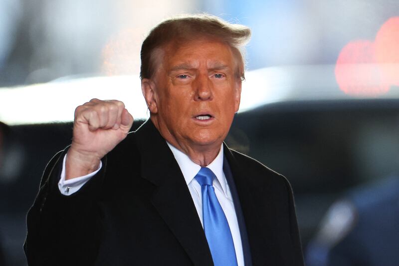 TOPSHOT - Former US President Donald Trump leaves Trump Tower for Manhattan federal court for the second defamation trial against him, in New York City on January 22, 2024. Writer E. Jean Carroll is seeking more than $10 million in damages in the civil trial, alleging that Trump defamed her in 2019 when he was president and she had just come out with her allegation, saying she "is not my type."  This is separate to a civil case last year where another New York jury found Trump liable for sexually assaulting Carroll in a department store dressing room in 1996 and subsequently defaming her in 2022, when he called her a "complete con job." (Photo by Charly TRIBALLEAU / AFP) (Photo by CHARLY TRIBALLEAU/AFP via Getty Images)