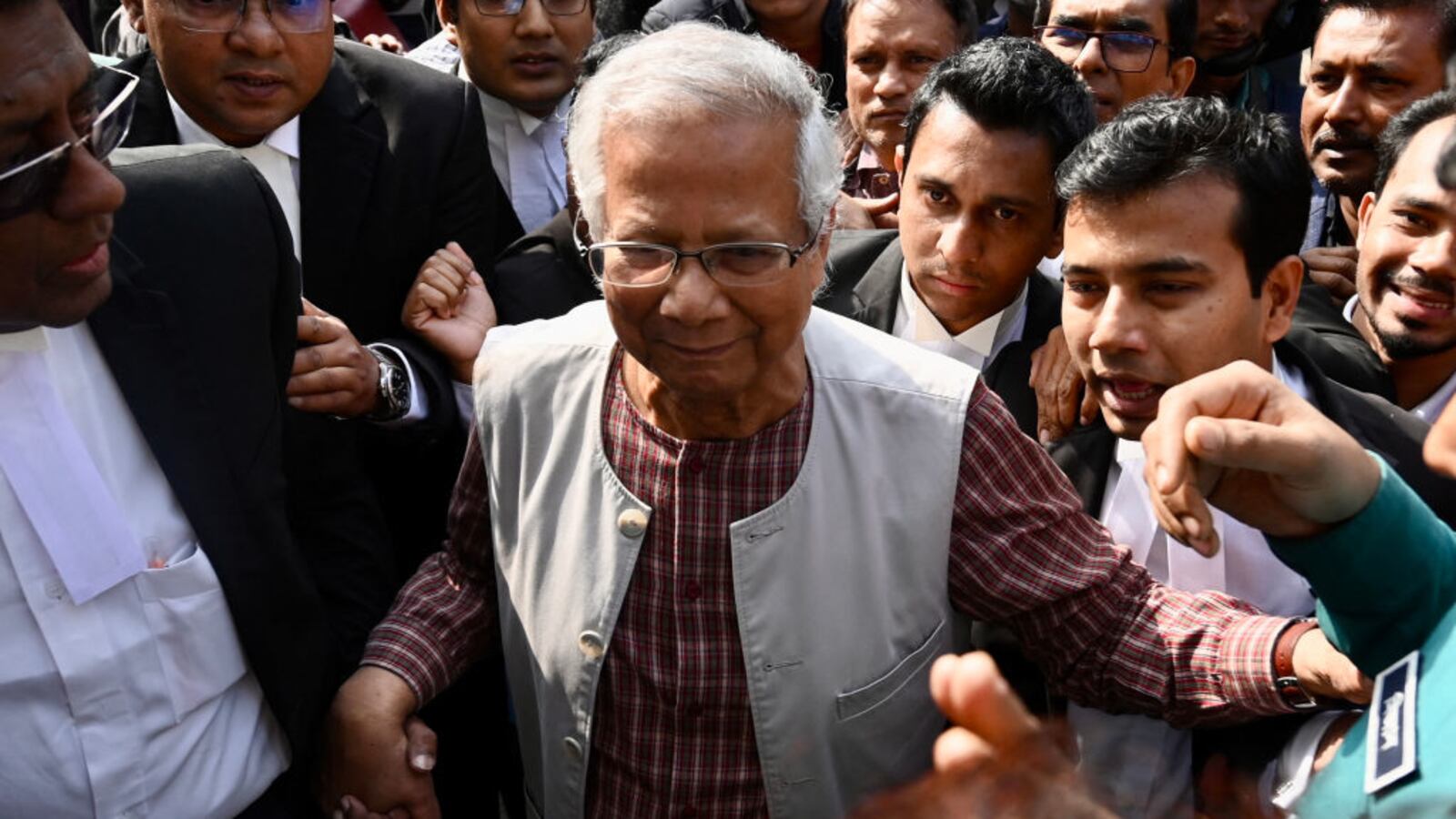 Bangladeshi Nobel peace laureate Muhammad Yunus appears in a court in Dhaka.