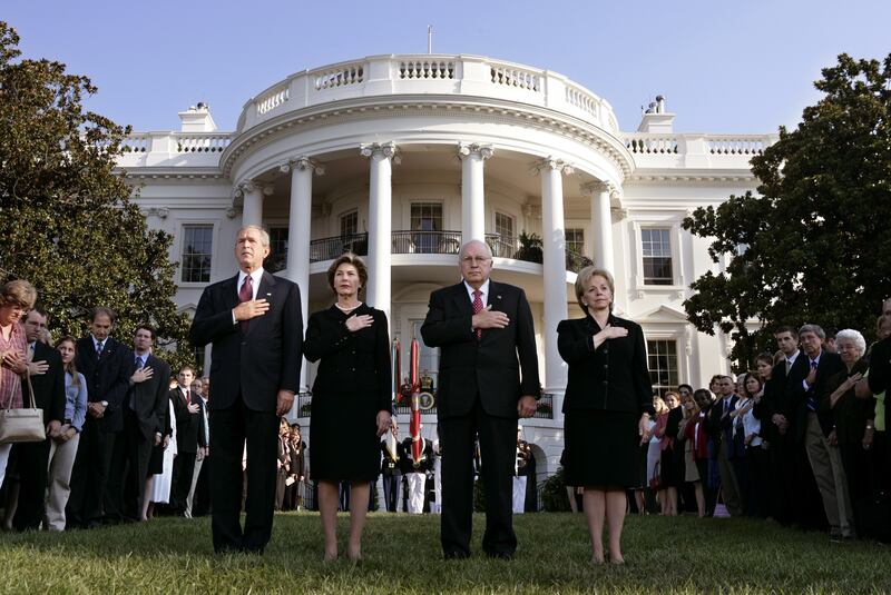 George W. Bush, Laura Bush, Dick Cheney, and Lynne Cheney participating in a moment of silence on the south lawn of the White House in Washington, D.C September 11, 2005, to honor the fourth anniversary of September 11, 2001 terrorist attacks.