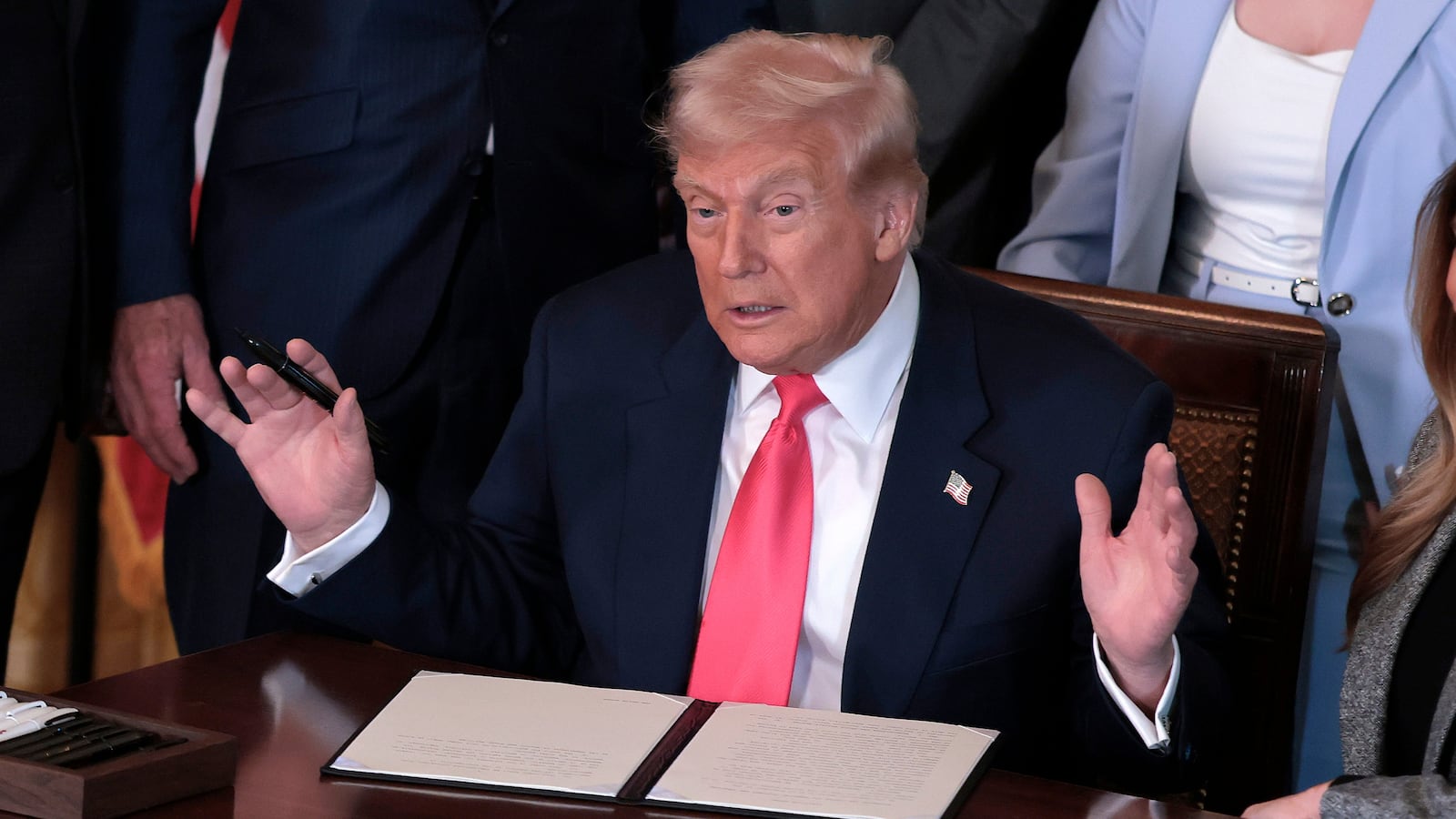 WASHINGTON, DC - NOVEMBER 13: U.S. President Donald Trump, joined by first lady Melania Trump, members of his administration and foster care advocates, speaks before signing the "Fostering the Future" executive order in the East Room of the White House on November 13, 2025 in Washington, DC. The executive order, championed by first lady Melania Trump, works to expand opportunities for education, career development, housing and other resources for youth transitioning from foster care to adulthood. (Photo by Heather Diehl/Getty Images)