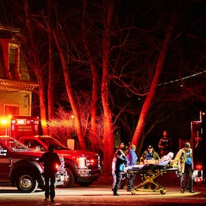 First responders with the Providence Fire Department maneuver an empty stretcher near the Barus & Holley building.