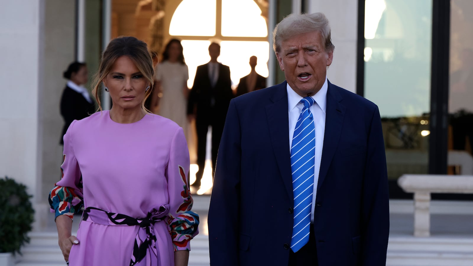 Republican presidential candidate, former US President Donald Trump and former first lady Melania Trump arrive at the home of billionaire investor John Paulson on April 6, 2024 in Palm Beach, Florida.