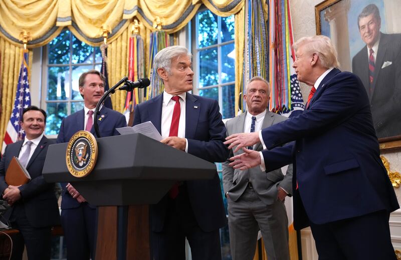 WASHINGTON, DC - OCTOBER 10: U.S. President Donald Trump (R) gestures toward Centers for Medicare & Medicaid Services Mehmet Oz (C) as (L-R) AstraZeneca CEO Pascal Soriot, Virginia Gov. Glenn Youngkin, and Health and Human Services Secretary Robert F. Kennedy Jr. look on in the Oval Office of the White House on October 10, 2025 in Washington, DC. Trump is announcing a deal with pharmaceutical company AstraZeneca to lower U.S. prescription drug prices. (Photo by Andrew Harnik/Getty Images)