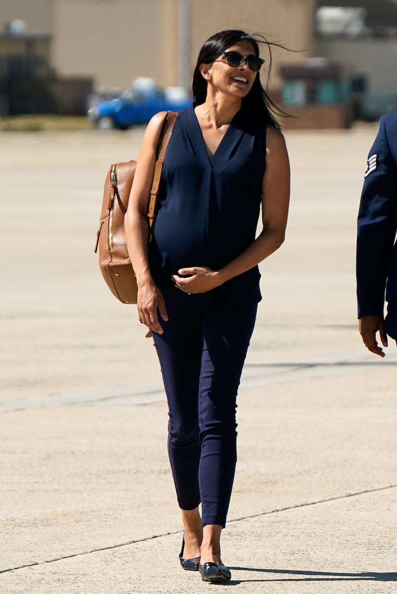 U.S. second lady Usha Vance touches her abdomen after disembarking Marine Two as she arrives at Joint Base Andrews, Maryland, U.S., June 20, 2026. REUTERS/Elizabeth Frantz/Pool