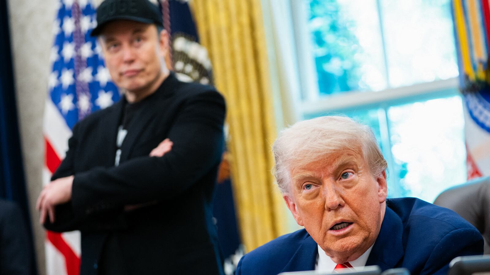 US President Donald Trump speaks during a news conference with Elon Musk (L) in the Oval Office of the White House in Washington, DC, on May 30, 2025. Musk, who stormed into US politics as President Trump's chainsaw-brandishing sidekick, announced on May 28 that he is leaving his role in US government, intended to reduce federal spending, shortly after his first major break with the President over Trump's signature spending bill. (Photo by Allison ROBBERT / AFP) (Photo by ALLISON ROBBERT/AFP via Getty Images)