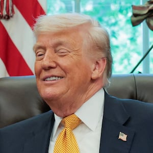 U.S. President Donald Trump shakes hands with Ilia Topuria, as he holds an event with UFC fighters in the Oval Office at the White House in Washington, D.C., U.S., May 6, 2026.