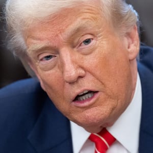 US President Donald Trump speaks with the media after signing a funding bill to end a partial government shutdown in the Oval Office of the White House in Washington, DC, February 3, 2026.