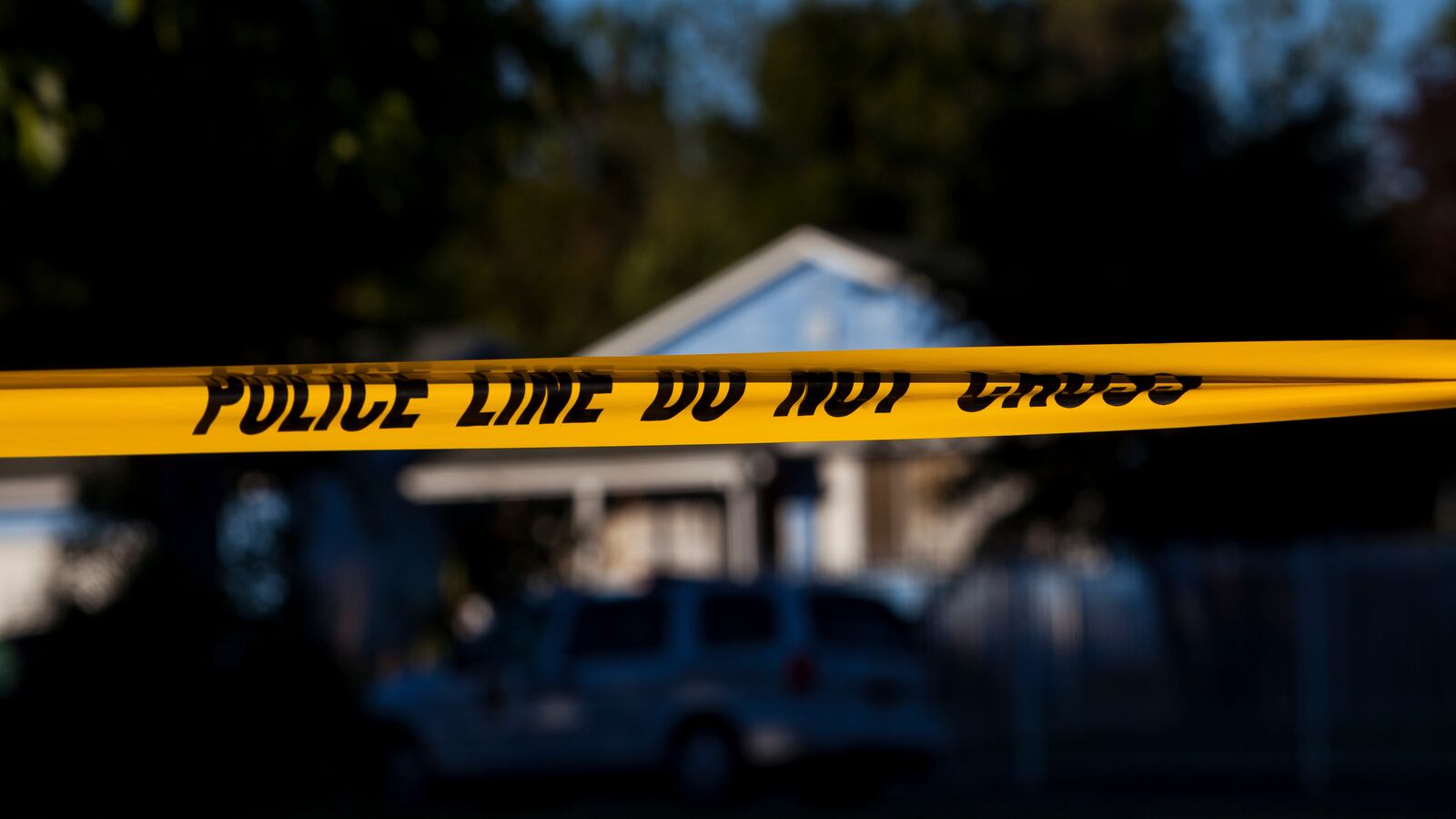 Police tape is put up in front of a California house.