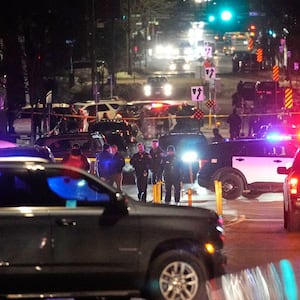 Law enforcement at the scene of a reported shooting Wednesday, Jan. 14, 2026, in Minneapolis.