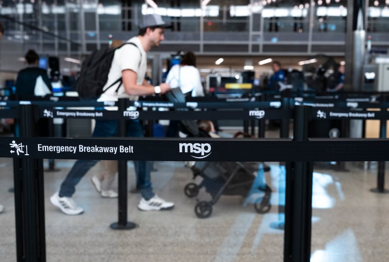 Travelers navigate security lines at Minneapolis-St. Paul International Airport Terminal 1 on March 23, 2026 in Minneapolis, Minnesota.