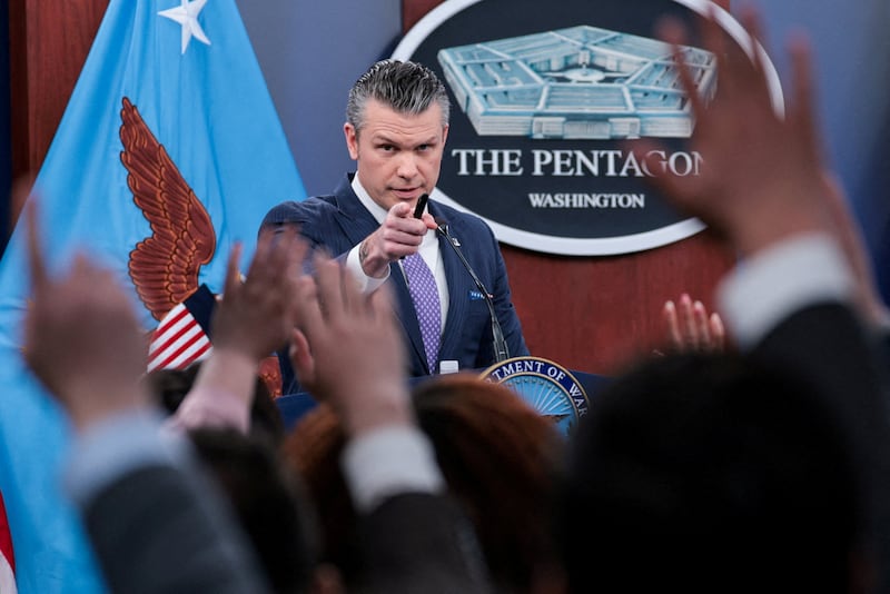 Members of the media raise hands to ask questions during a briefing held by U.S. Secretary of Defense Pete Hegseth and Chairman of the Joint Chiefs of Staff General Dan Caine (not pictured), amid the U.S.-Israeli conflict with Iran, at the Pentagon in Washington, D.C., U.S., March 31, 2026. REUTERS/Jonathan Ernst     TPX IMAGES OF THE DAY