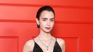 Lily Collins attends the Season 5 premiere of 'Emily In Paris' at Le Grand Rex in Paris on December 15, 2025.