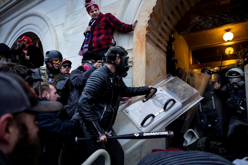 Trump supporters clash with police and security forces as people try to storm the US Capitol on January 6, 2021 in Washington, DC.