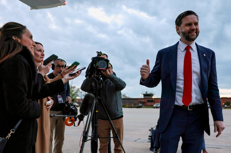 U.S. Vice President JD Vance gives a thumbs up next to media members before boarding Air Force Two to depart for Budapest, Hungary, from Joint Base Andrews, Maryland, U.S., April 6, 2026