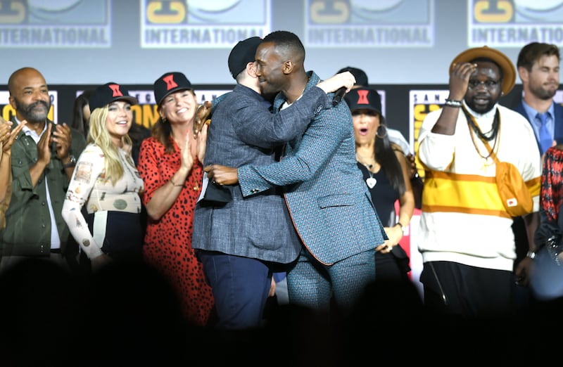 Marvel chief Kevin Feige embraced Mahershala Ali on stage at Comic-Con in 2019.