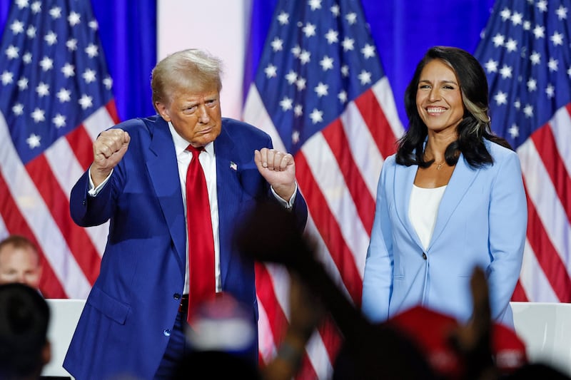 TOPSHOT - Former US President and Republican presidential candidate Donald Trump (L) dances as he leaves the stage after speaking alongside former US Representative Tulsi Gabbard during a town hall meeting in La Crosse, Wisconsin, on August 29, 2024. (Photo by KAMIL KRZACZYNSKI / AFP) (Photo by KAMIL KRZACZYNSKI/AFP via Getty Images)