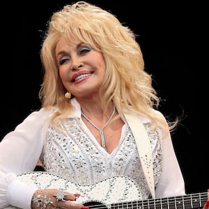 FILE PHOTO: American country music star Dolly Parton performs on the Pyramid Stage at Worthy Farm in Somerset, during the Glastonbury Festival June 29, 2014. REUTERS/Cathal McNaughton (BRITAIN - Tags: ENTERTAINMENT SOCIETY TPX IMAGES OF THE DAY)/File Photo