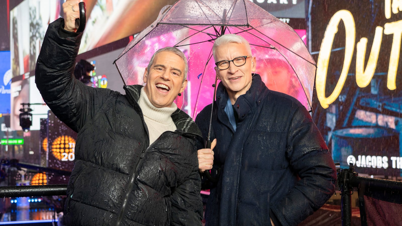 Andy Cohen and Anderson Cooper host CNN's New Year's Eve coverage in the rain in Times Square on December 31, 2024 in New York City.