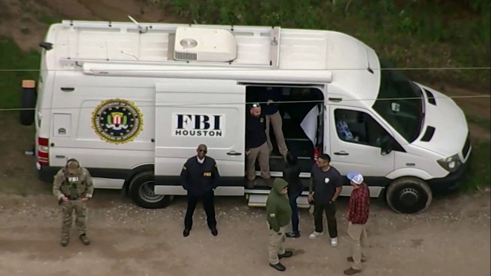 An FBI van where a search is being conducted for Francisco Oropeza, 38, who police say shot dead five neighbors in Cleveland, Texas, April 29, 2023.
