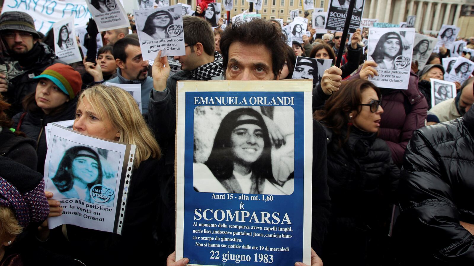 Pietro Orlandi, brother of “Vatican Girl” Emanuela Orlandi, holds a banner with her picture in front of St. Peter Square.