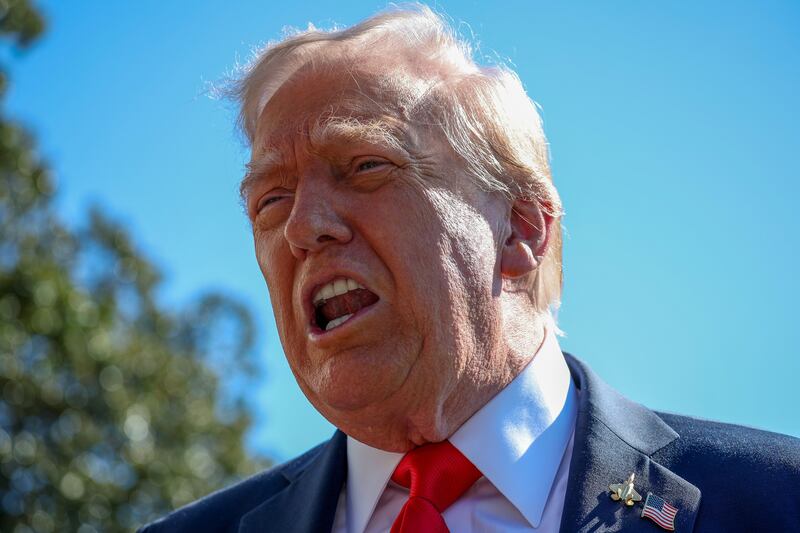 President Donald Trump talks to the media before heading to Marine One on the south lawn of the White House on October 05, 2025 in Washington, DC.