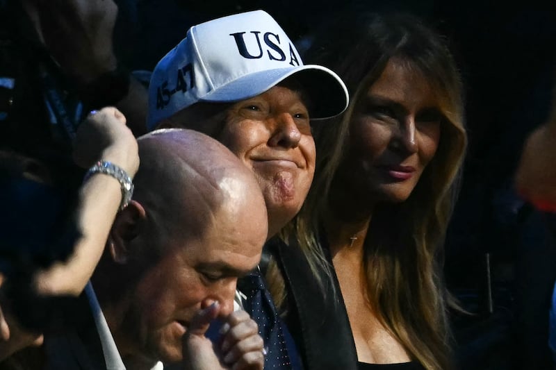 UFC CEO Dana White, US President Donald Trump and US First Lady Melania Trump attend the "UFC Freedom 250" mixed martial arts event on the South Lawn of the White House in Washington, DC, June 14, 2026.
