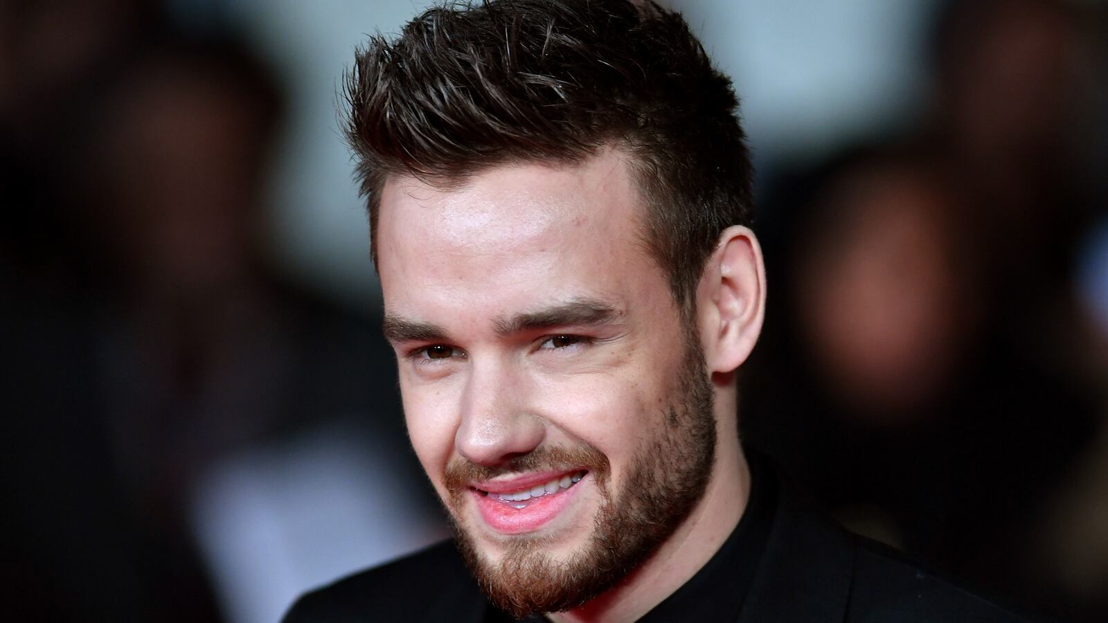 Liam Payne smiles