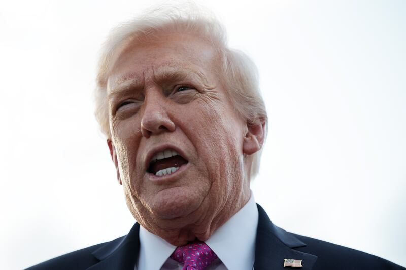 WEST PALM BEACH, FLORIDA - OCTOBER 17: U. S. President Donald Trump speaks to members of the press after he landed at West Palm Beach International Airport on October 17, 2025 in West Palm Beach, Florida. President Trump is spending his weekend at Mar-a-Lago in Palm Beach, Florida.  (Photo by Alex Wong/Getty Images)
