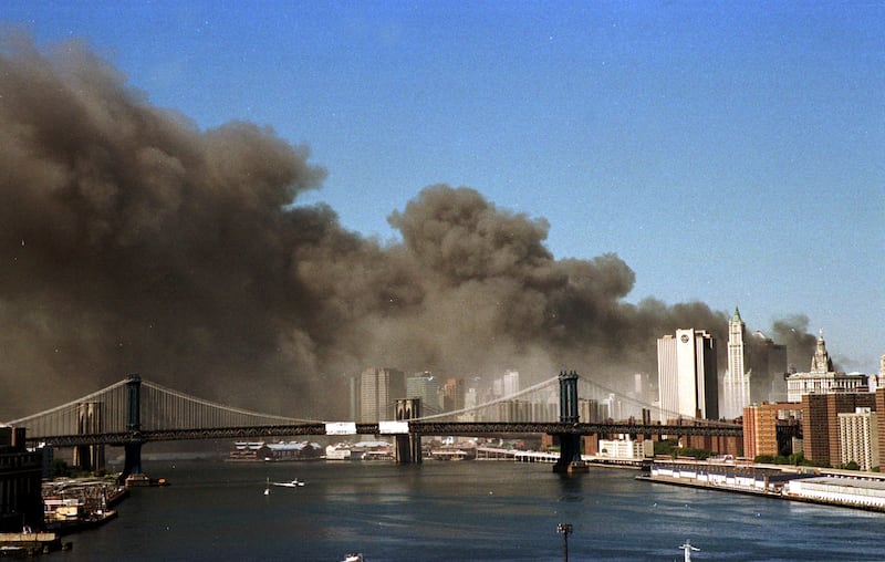 Smoke pours over the skyline of lower Manhattan shortly after the towers of the World Trade Center collapsed in New York on September 11, 2001.