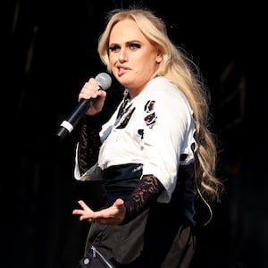 READING, ENGLAND - AUGUST 22: (EDITORIAL USE ONLY) Actress Rebel Wilson makes a surprise appearance on stage with The Kooks and performs 'Gangstas Paradise' during day one of Reading Festival 2025 at Richfield Avenue on August 22, 2025 in Reading, England. (Photo by Simone Joyner/Getty Images)