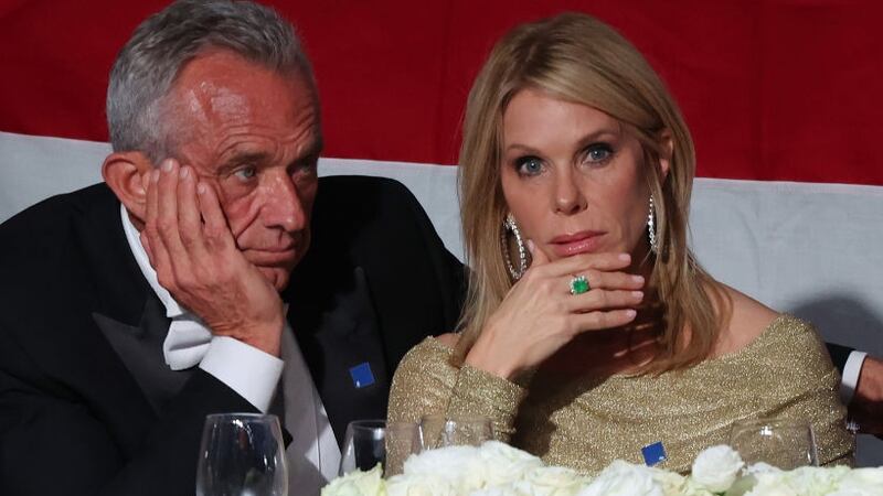 Former presidential candidate Robert F. Kennedy Jr. and his wife Cheryl Hines listen as Republican presidential nominee, former U.S. President Donald Trump speaks during the annual Alfred E. Smith Foundation Dinner at the New York Hilton Midtown on October 17, 2024 in New York City.