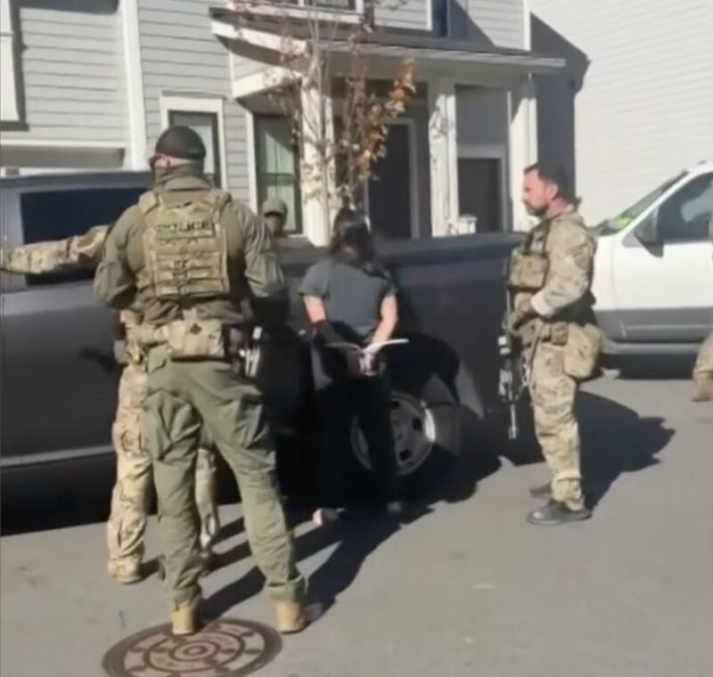 Border Patrol detain one of the women for alerting others to their presence.