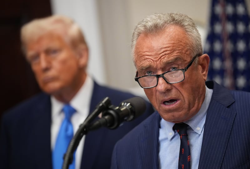 WASHINGTON, DC - SEPTEMBER 22: U.S. Health and Human Services Secretary Robert F. Kennedy Jr., joined by President Donald Trump (L), delivers an announcement on “significant medical and scientific findings for America’s children” in the Roosevelt Room of the White House on September 22, 2025 in Washington, DC. Federal health officials suggested a link between the use of acetaminophen during pregnancy as a risk for autism, although many health agencies have noted inconclusive results in the research. (Photo by Andrew Harnik/Getty Images)