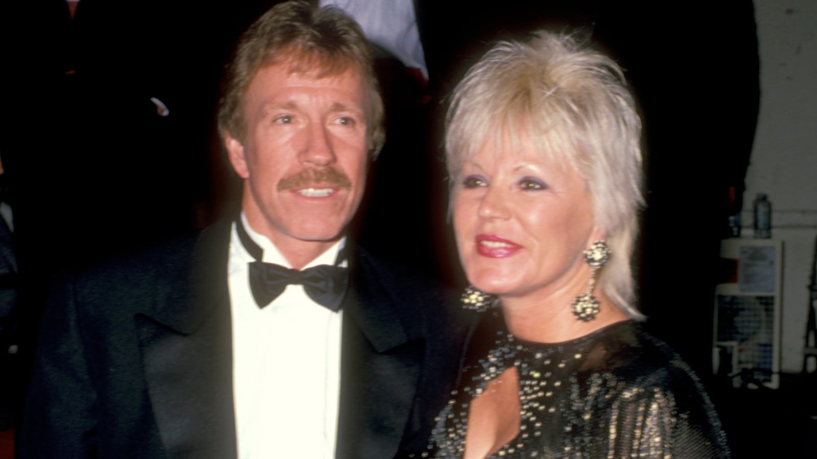 Actor Chuck Norris and wife Dianne Holechek attends the 16th Annual American Music Awards on January 30, 1989 at Shrine Auditorium in Los Angeles, California.