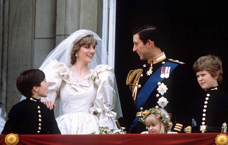Prince Charles and Princess Diana stand on the balcony of Buckingham Palace in London, following their wedding in 1981.